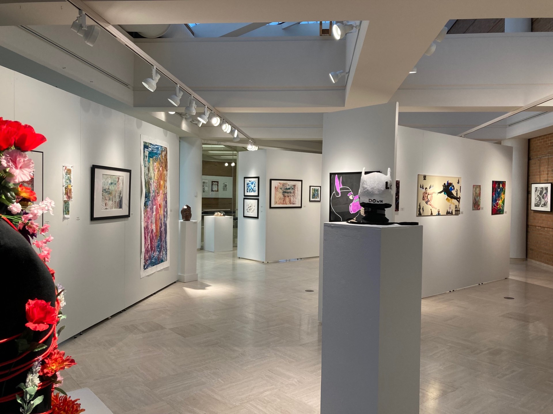 caulkins sculpture in foreground and right side image, Szymanski works on paper on left size of image
